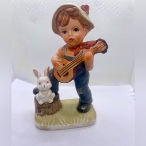 Adorable Boy Playing Guitar with Rabbit Figurine
